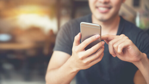 Male using mobile device