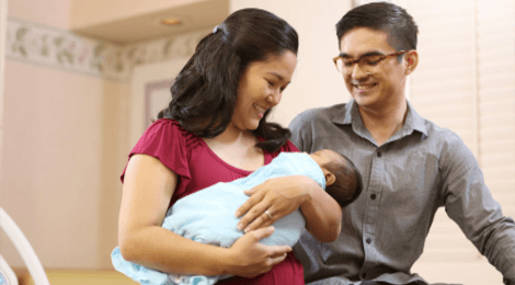 Man and woman holding a baby