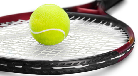 Tennis ball on racket