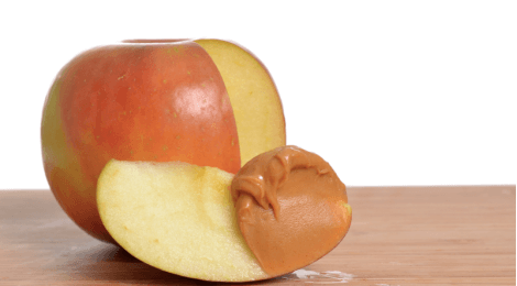 Close up of apple with peanut butter