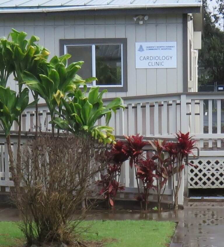 Outside of clinic with ramp and sign that says "Cardiology Clinic"