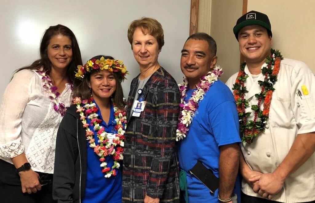 Employee of the Quarter nominee's with leis.