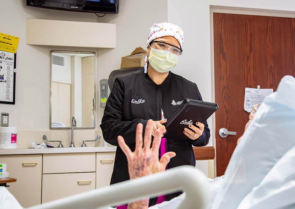 Female medical staff does a test with patient.