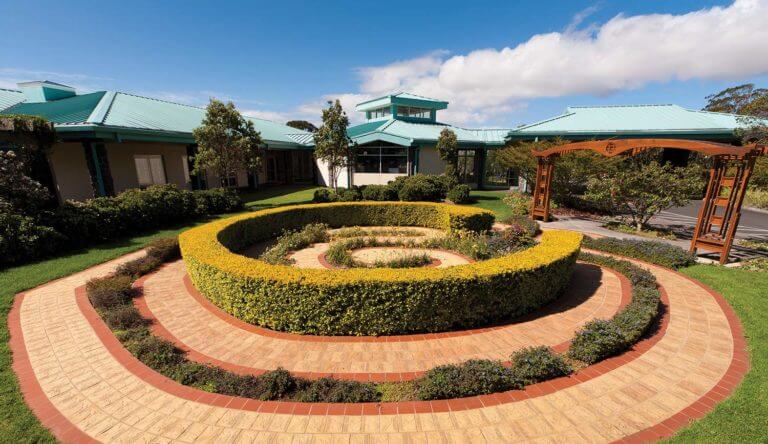Exterior of the Queen's North Hawaii Community Hospital front garden