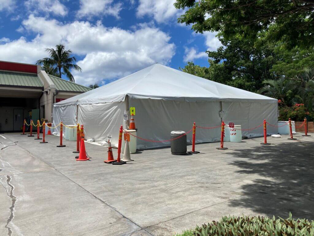 COVID-19 testing tend set up outside Medical Center with cones surrounding the perimeter.