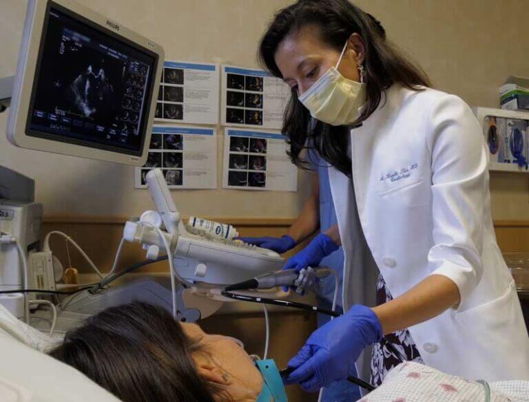 Cardiologist Dr. Kemble checking a patient's heart on ultrasound.