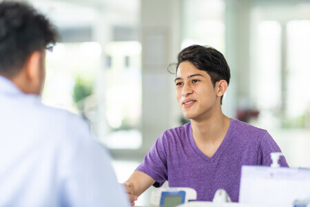 Man talking with doctor