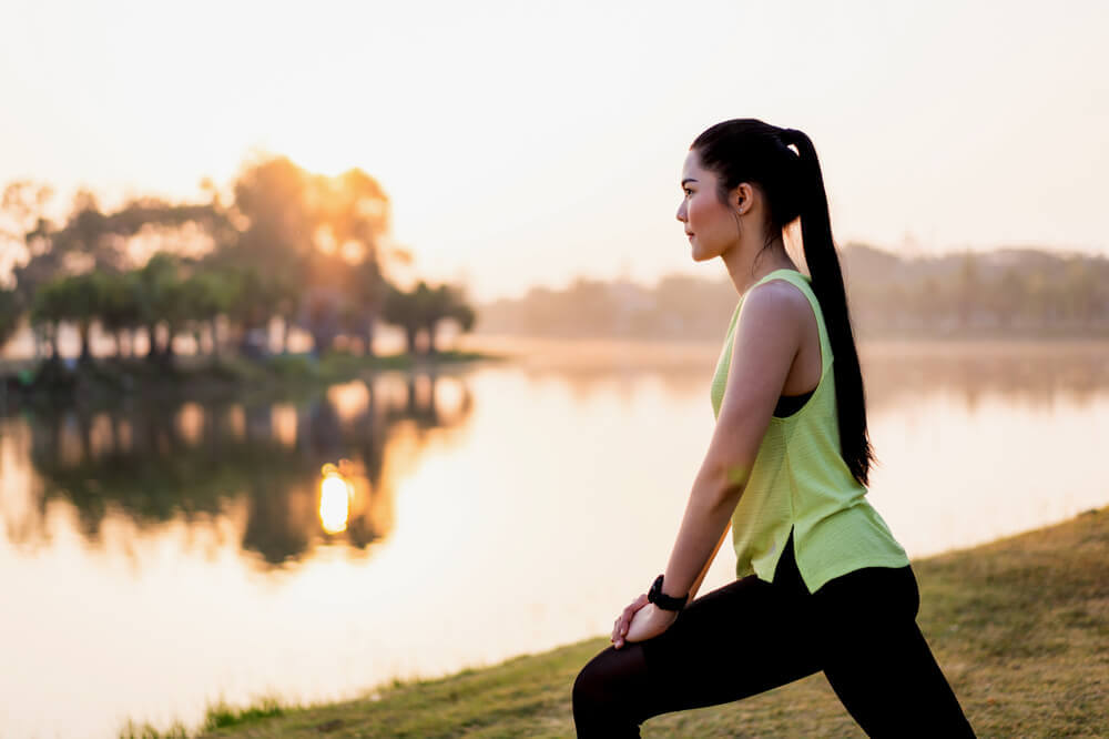 women stretching outside