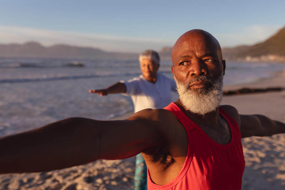 Couple Doing Beach Yoga